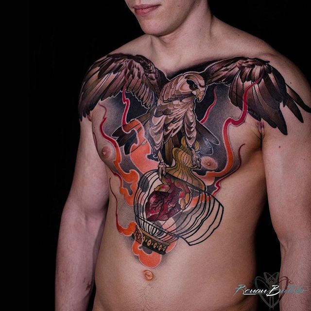 Big beautiful looking chest tattoo of eagle with open cage