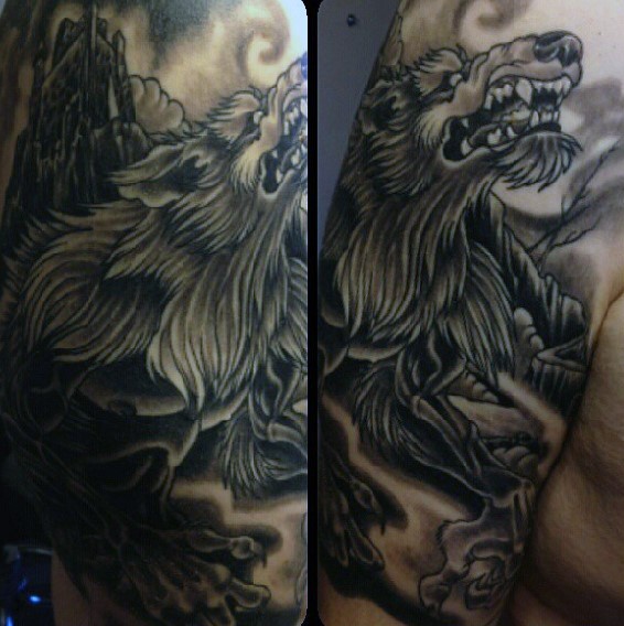 Big black and gray style colored shoulder tattoo of werewolf