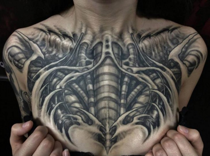 Big black and white bio-mechanical skeleton on chest tattoo
