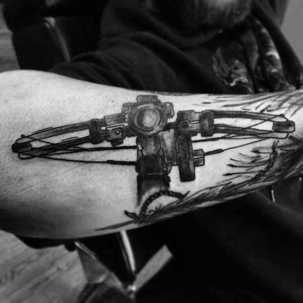 Big black and white detailed crossbow tattoo on arm