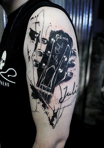Big black and white detailed Gibson guitar shoulder tattoo with lettering