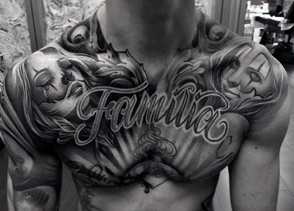 Big black and white lettering with seductive women tattoo on chest