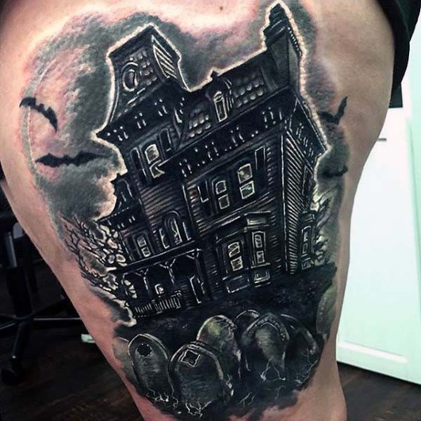 Big black and white mystical house with bats and cemetery tattoo on thigh