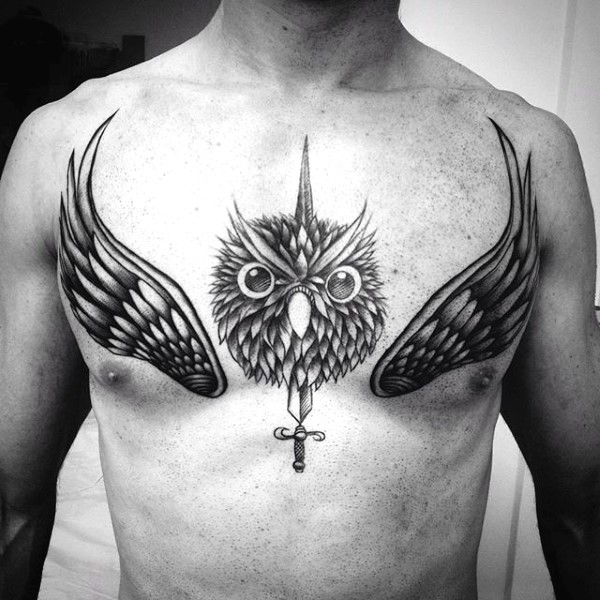 Big black and white owl head with sword and wings tattoo on chest ...