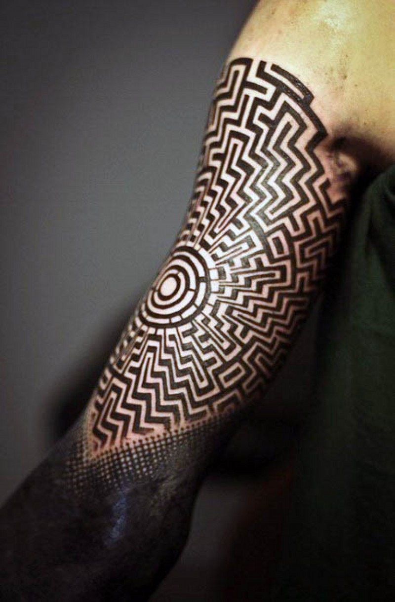 Big black and white Polynesian ornament tattoo on arm