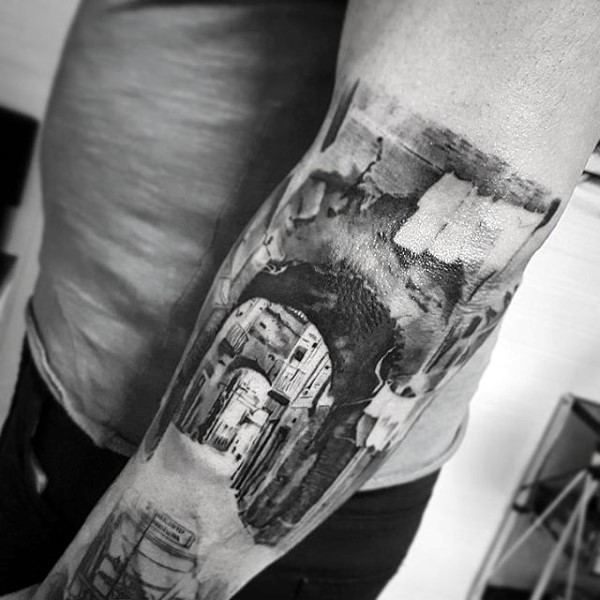 Big black and white real photo like black ink old city tattoo on arm