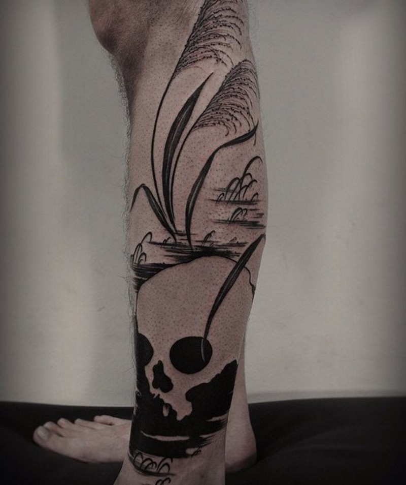 Big black and white skull on lake shore leg tattoo