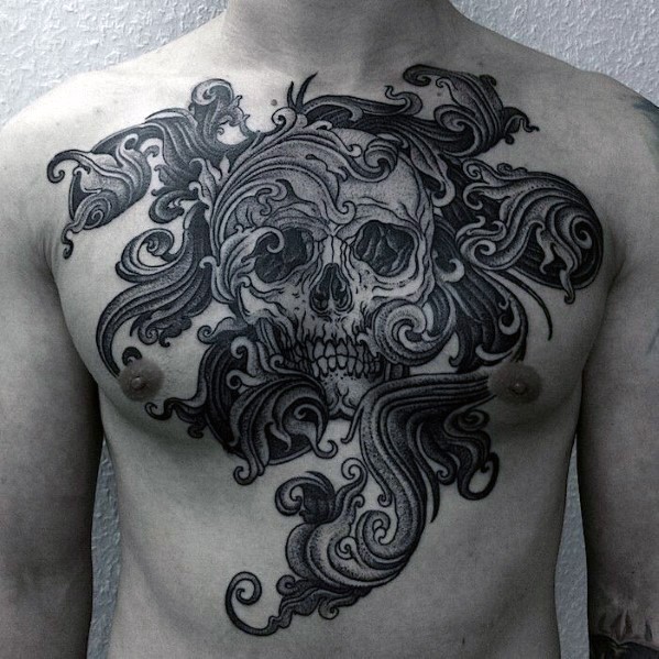 Tatuaje en el pecho,  cráneo con olas, colores negro blanco