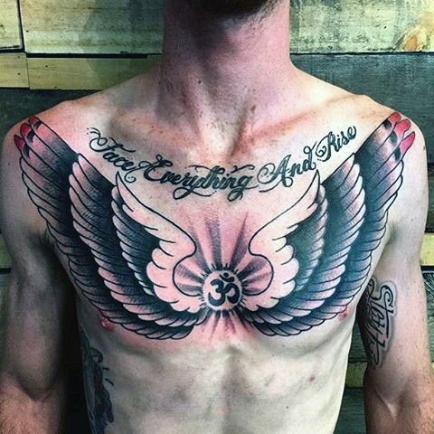 Big black and white wings with lettering and symbol tattoo on chest