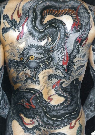 Big black horrendous dragon tattoo on whole back