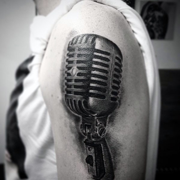 Big black ink 3D realistic vintage microphone tattoo on shoulder