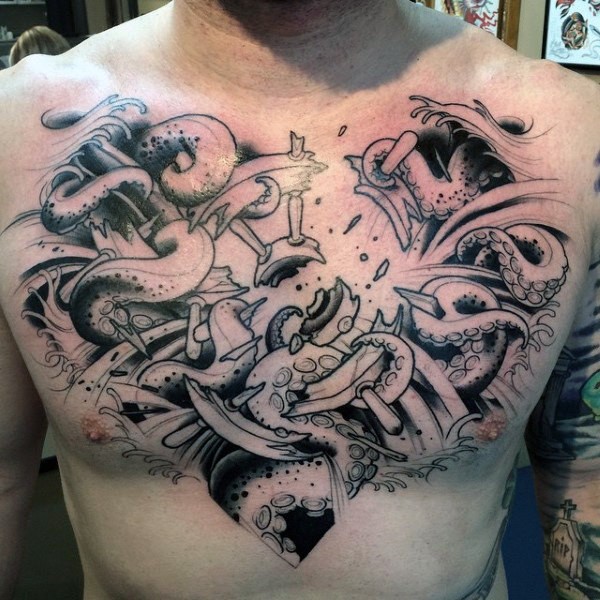 Big black ink chest tattoo of of broken ships steering wheel and octopus