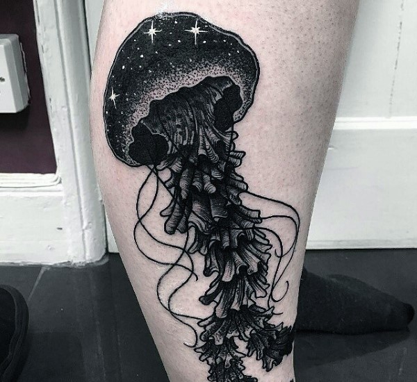 Big black ink detailed jellyfish stylized with night sky tattoo on leg