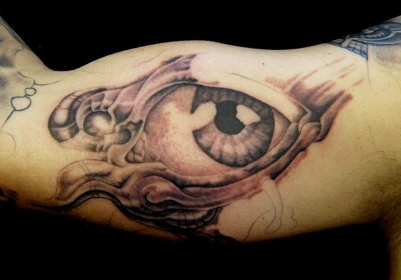 Big black ink futuristic eye tattoo on arm