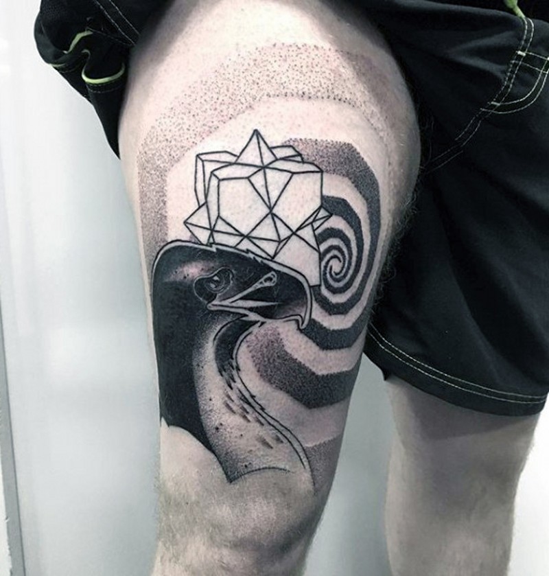 Big black ink hypnotic picture tattoo on thigh combined with eagle head and geometrical figure