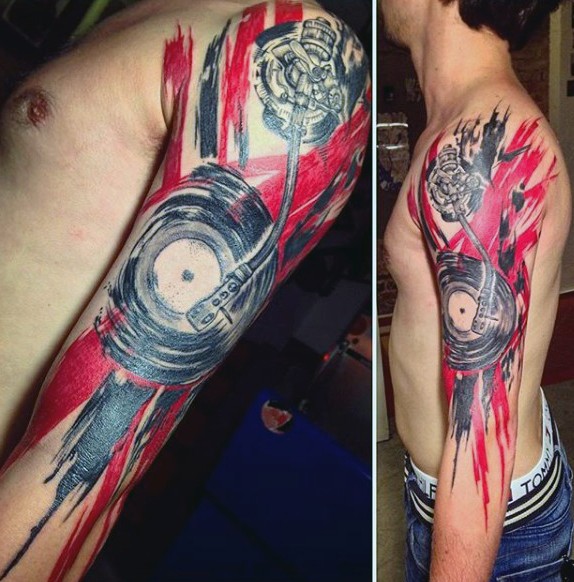 Big black ink musical themed tattoo with national flag tattoo on arm
