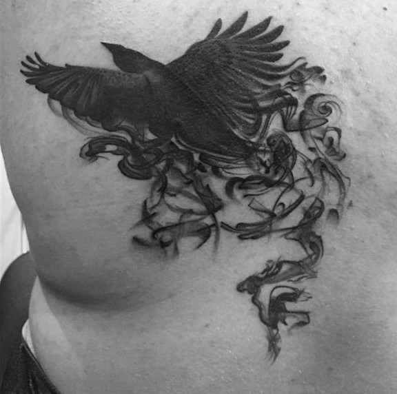 Big black ink mystical flying crow tattoo on back
