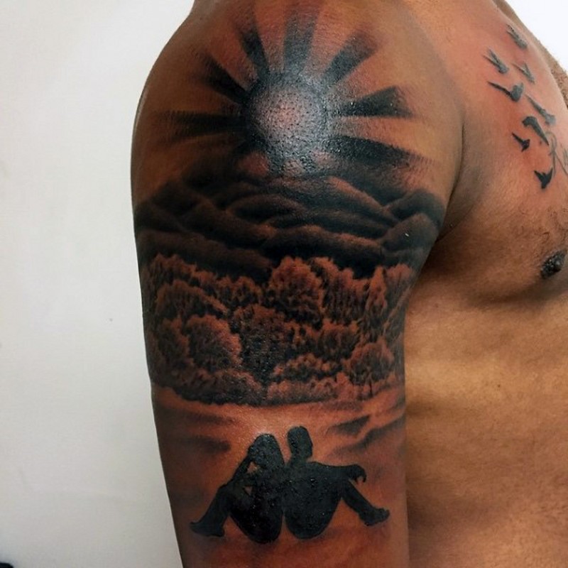 Big black ink romantic couple with sunset tattoo on shoulder