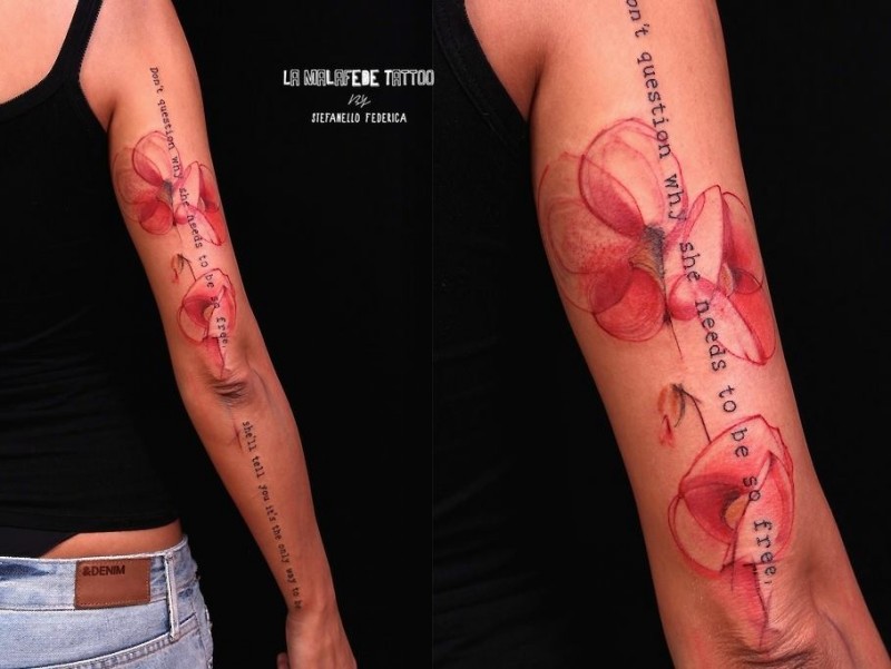 Big black ink sleeve tattoo of red flower and lettering