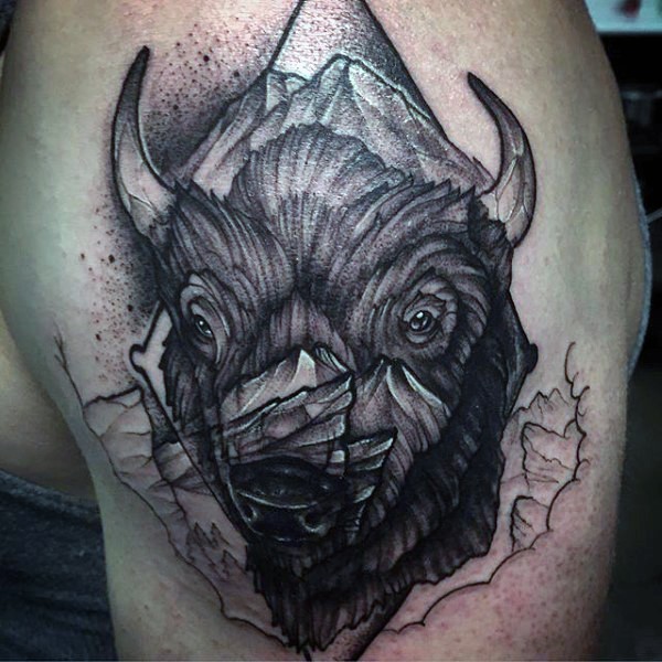 Big black ink stippling style shoulder tattoo of bulls head