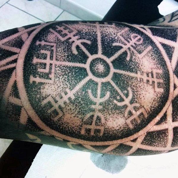 Big black ink stippling style tattoo of ancient symbols