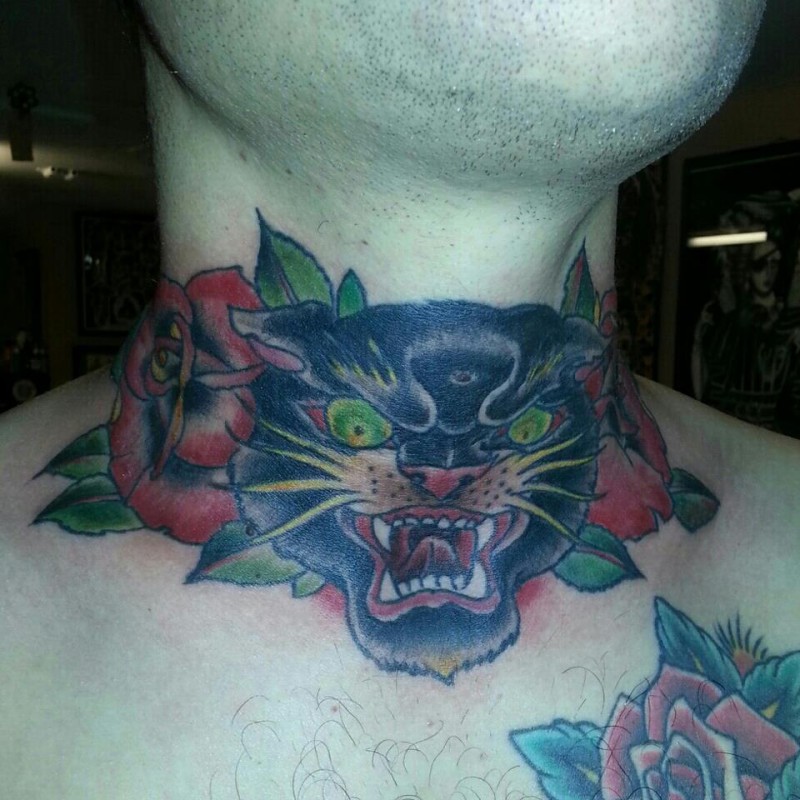 Big cat with roses throat tattoo