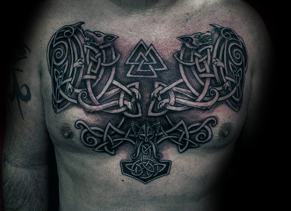 Big Celtic style chest tattoo of various symbols and knots