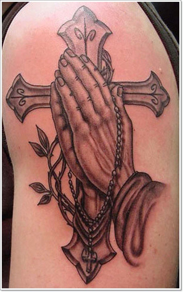Big Christian style black ink cross with praying hands tattoo on shoulder