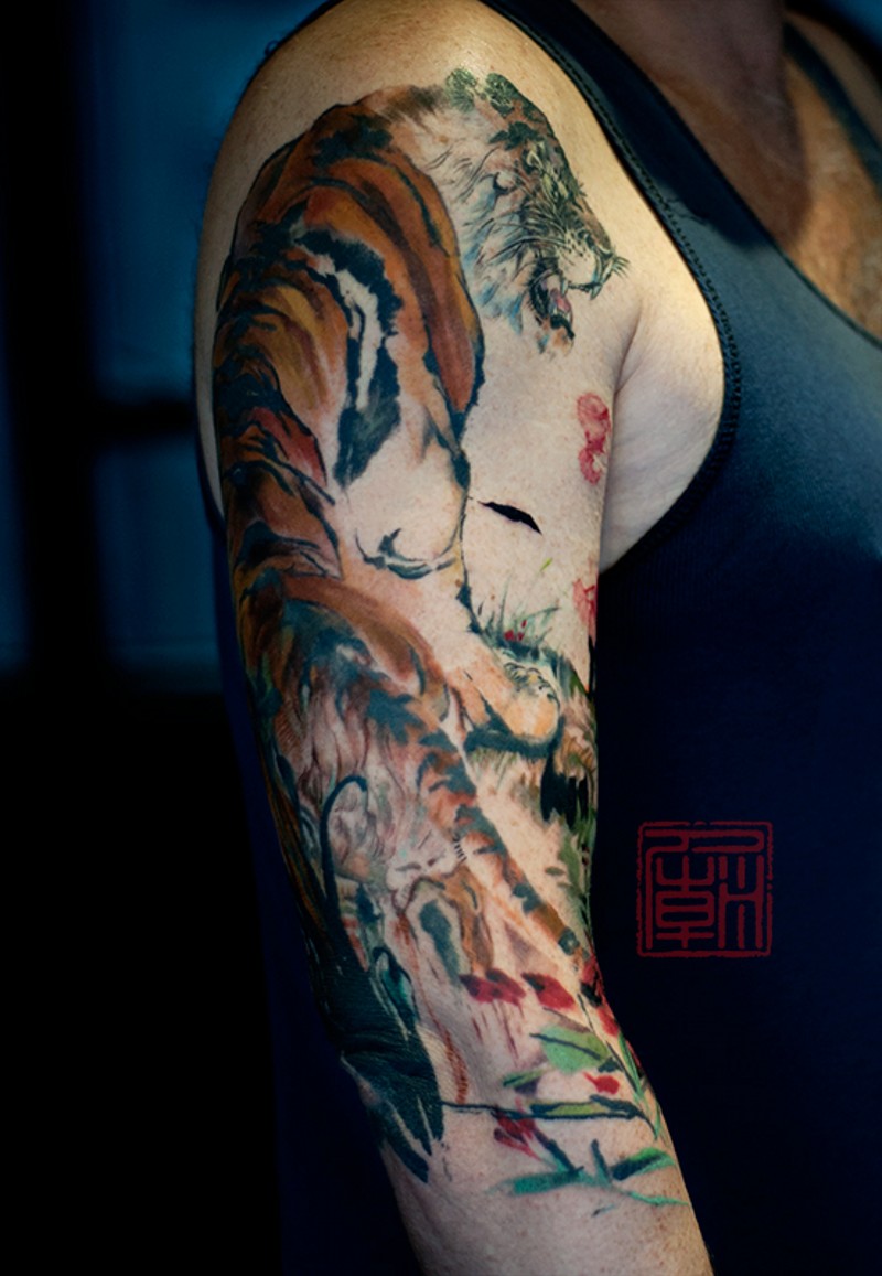 Big colored 3D like multicolored shoulder tattoo of tiger in jungle