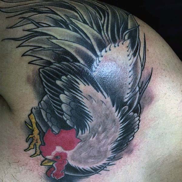 Big colored and detailed dancing cock tattoo on shoulder