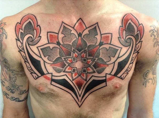 Big colored chest tattoo of cool looking flower