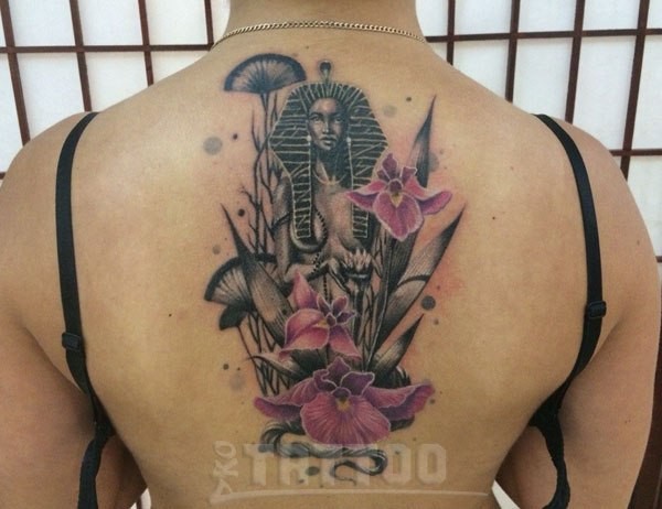 Big colored Egypt woman statue tattoo on back with flowers