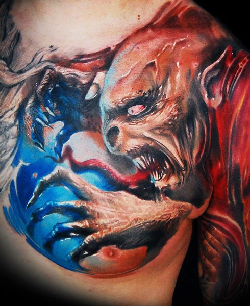 Big colored horror style detailed evil devil tattoo on chest and shoulder