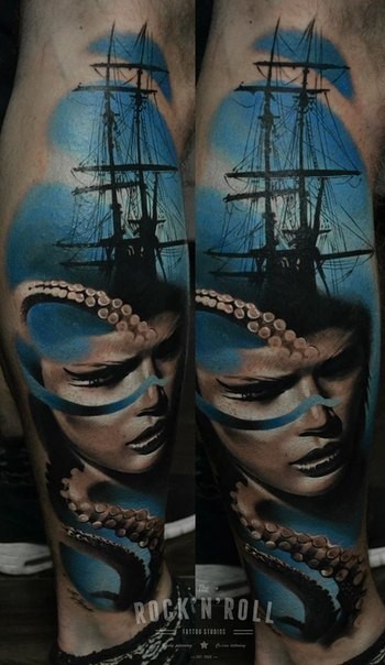 Big colored leg tattoo of big ship with woman face and octopus