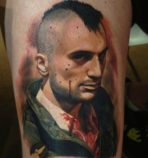 Big colored portrait style thigh tattoo of bloody man