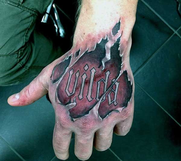 Big colored ripped skin tattoo with lettering on arm