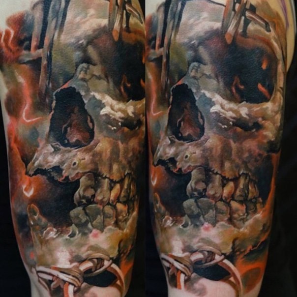 Big colored shoulder tattoo of human skull