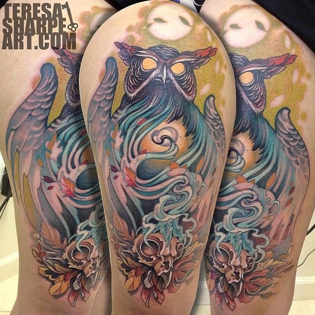Big colorful demonic owl tattoo on shoulder with steaming bird skull