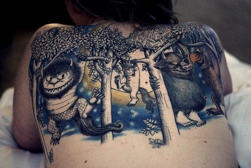 Big colorful fantasy creatures with trees tattoo on upper back