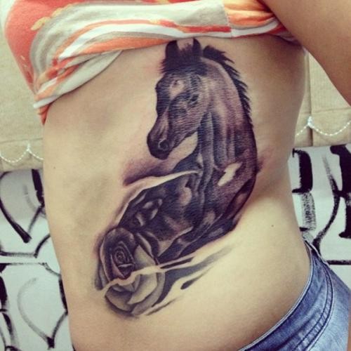 Big dark horse and rose tattoo on ribs for girls