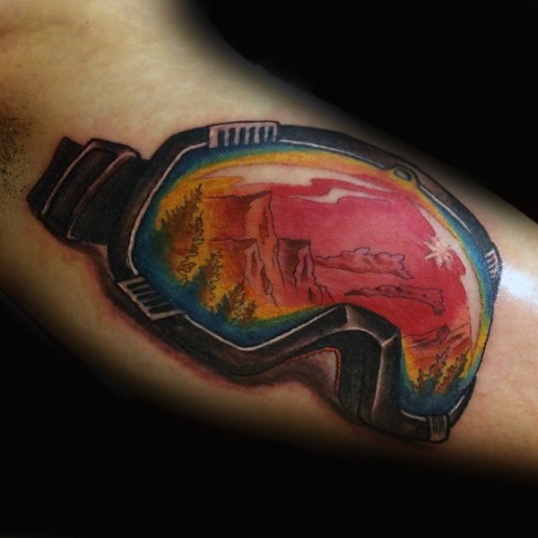 Big detailed arm tattoo of snowboarders mask