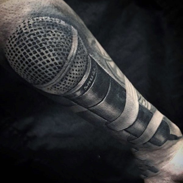 Big detailed black and white modern microphone tattoo on arm