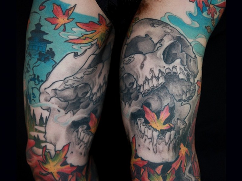 Big fantasy human skull tattoo on half sleeve with leaves and Asian house