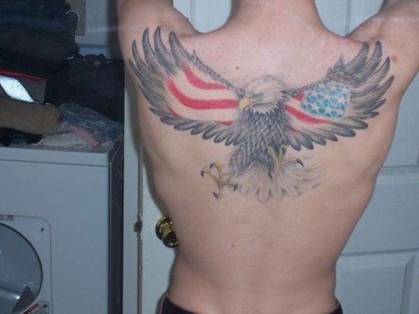Big flying eagle with flag usa on wings tattoo on back