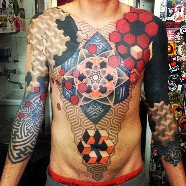 Big geometrical style chest, belly and sleeve tattoo of various ornaments