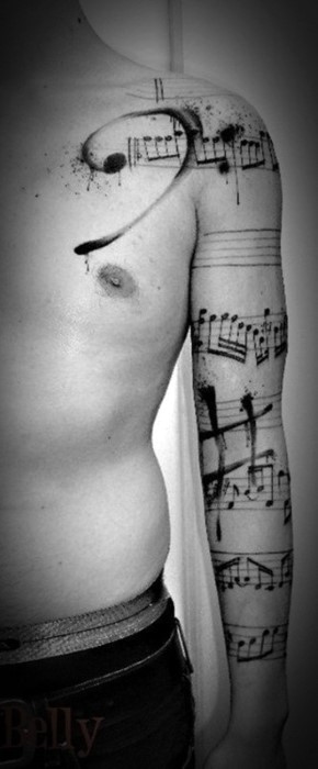 Big great painted black ink music notes tattoo on sleeve