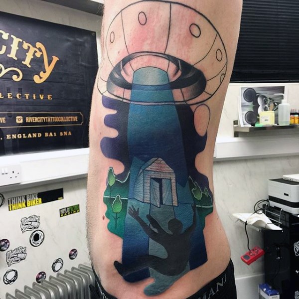 Big half colored alien ship stealing human tattoo on side