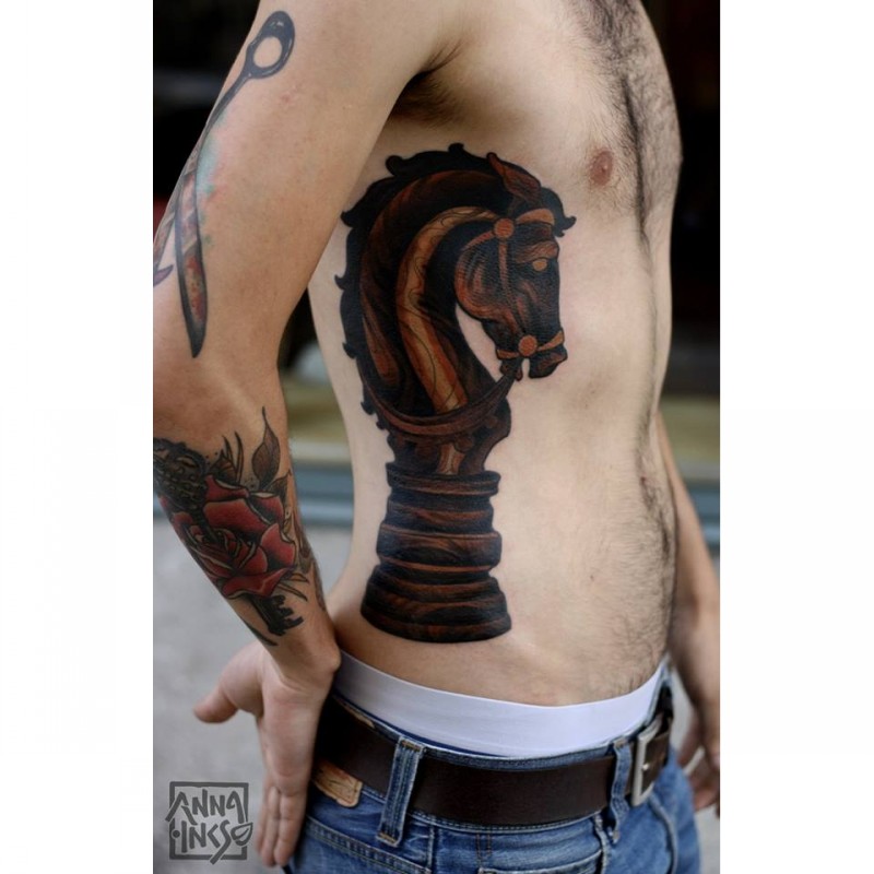 Big illustrative style side tattoo of wooden chess figure