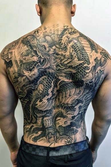 Big illustrative style whole back tattoo of fantasy dragon
