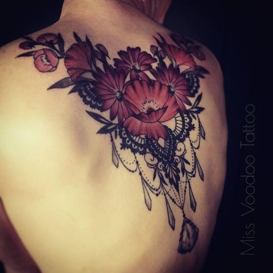 Big modern style upper back tattoo of cute flowers with jewelry